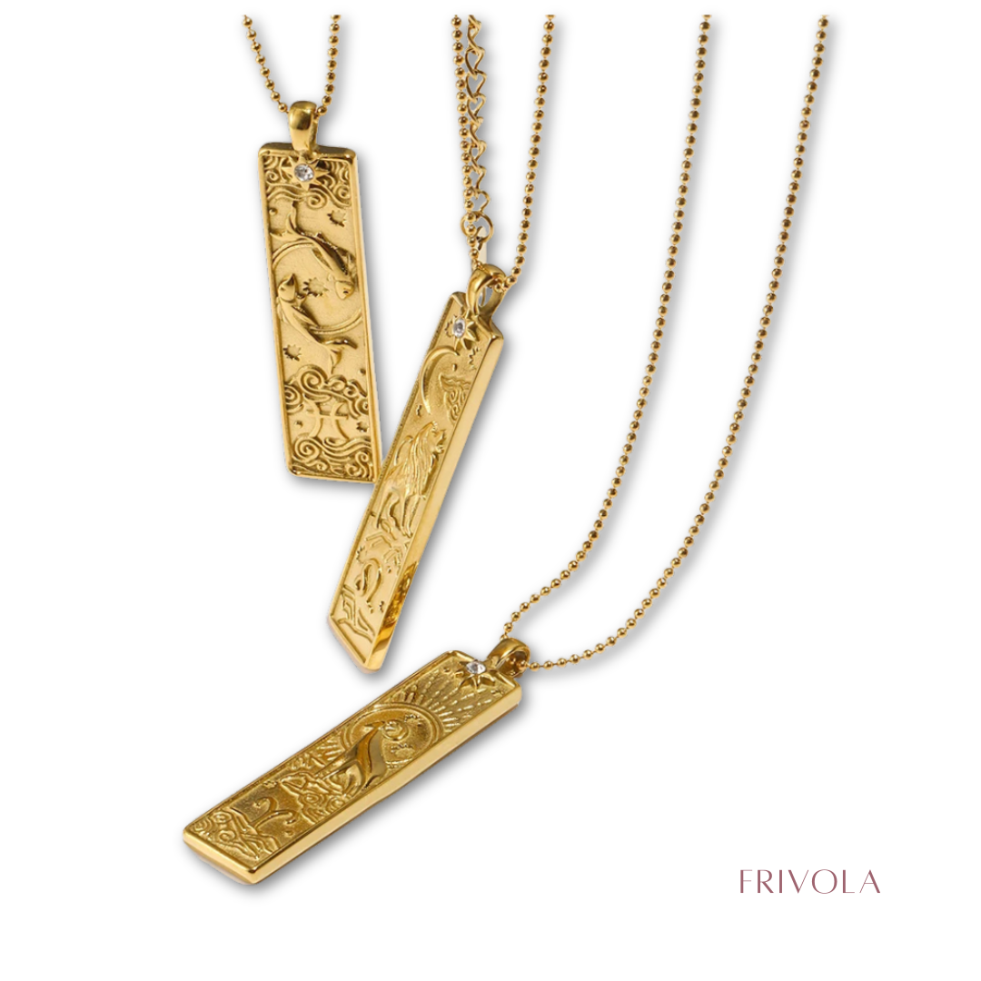 Three gold rectangular pendant necklaces with engraved floral and wave patterns, hanging on gold ball chains against a white background, with the Frivola brand name in the bottom right corner.